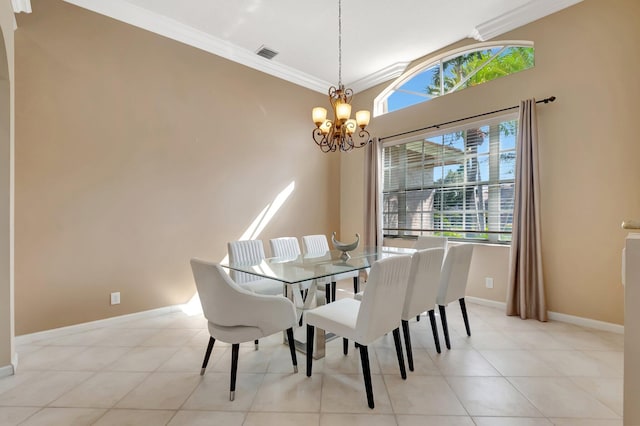 dining room with light tile patterned floors, a notable chandelier, and crown molding