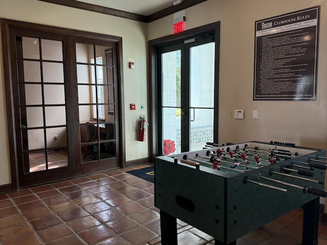 3113 Clint Moore Rd Unit 103, Boca Raton, FL 33496 - playroom featuring ornamental molding, french doors, baseboards, and dark tile patterned flooring