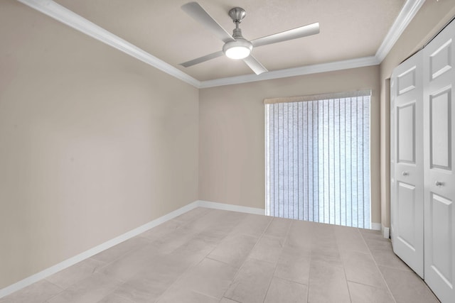 unfurnished bedroom featuring ceiling fan, a closet, light tile patterned floors, and ornamental molding