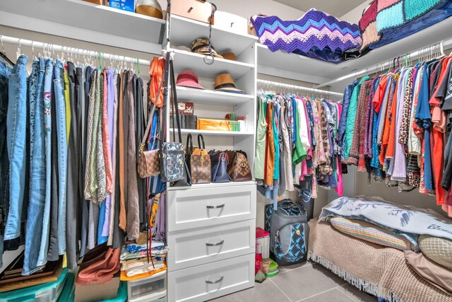 walk in closet featuring light tile patterned floors