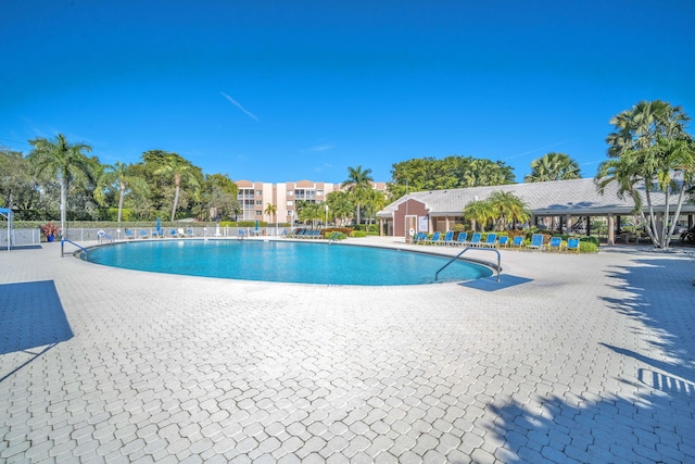 view of swimming pool with a patio