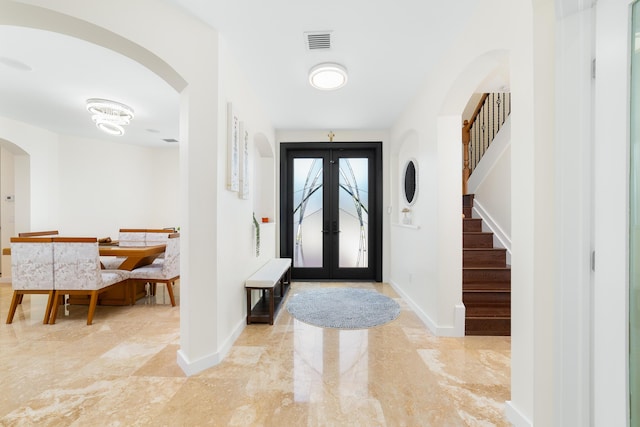 foyer entrance featuring french doors