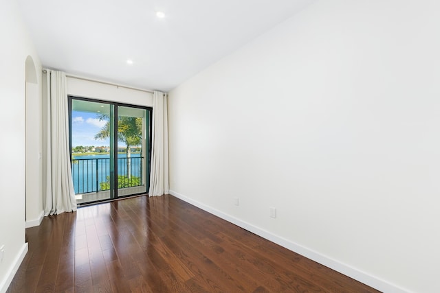 empty room featuring dark wood-type flooring