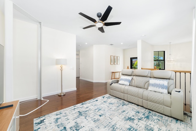 living room with hardwood / wood-style floors and ceiling fan