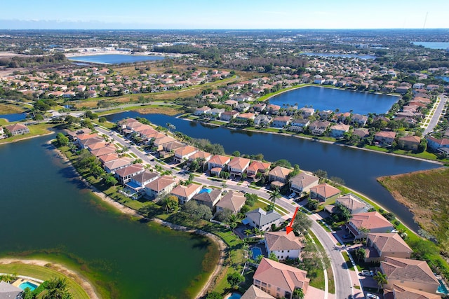 drone / aerial view with a water view