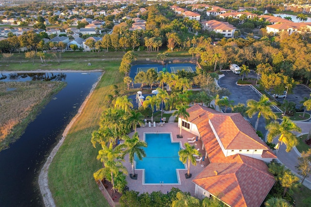 birds eye view of property with a water view