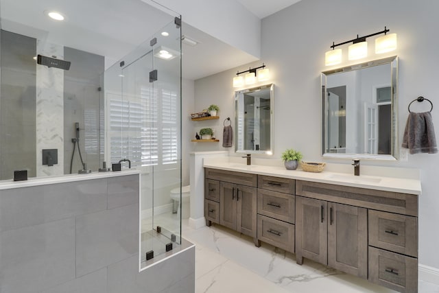 bathroom with vanity, toilet, and walk in shower