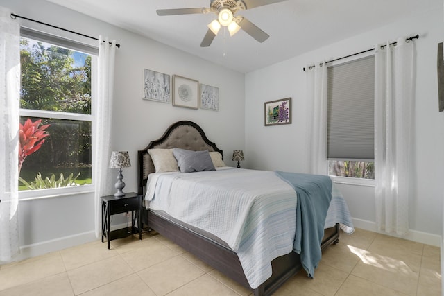 tiled bedroom with ceiling fan