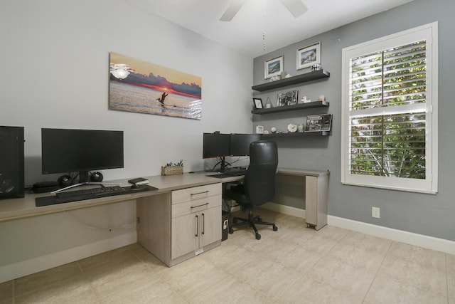 tiled office space with ceiling fan