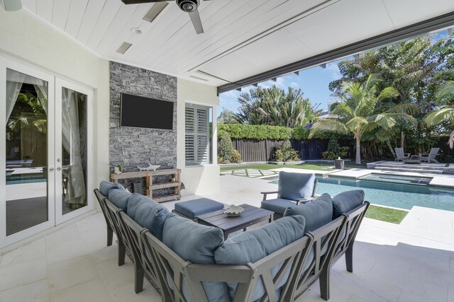 view of patio / terrace featuring french doors, an outdoor hangout area, a fenced in pool, and ceiling fan