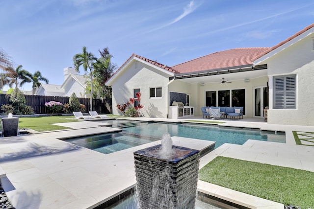 view of pool with an outdoor hangout area, a patio, ceiling fan, and a lawn