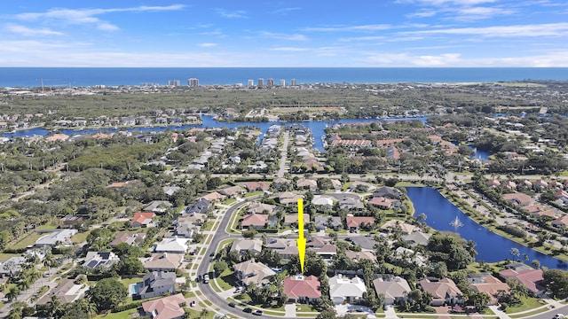 birds eye view of property featuring a water view