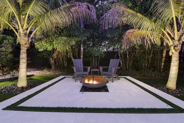 view of patio with a fire pit