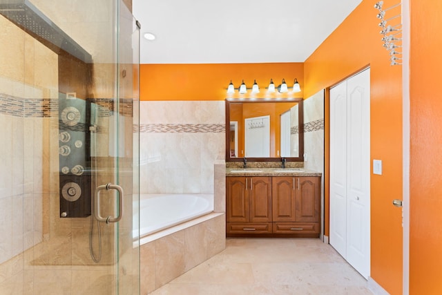 bathroom with tile patterned flooring, vanity, and independent shower and bath