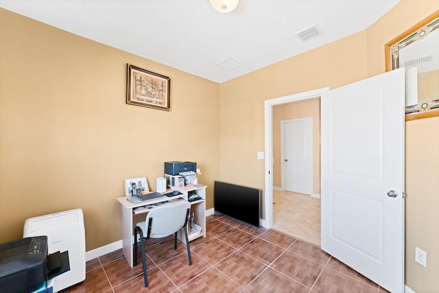 office space with tile patterned flooring