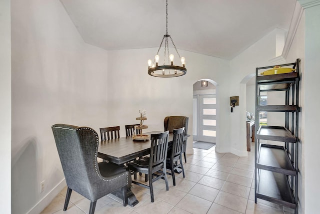 dining space featuring an inviting chandelier and light tile patterned flooring