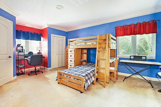 bedroom featuring carpet flooring, a closet, and ornamental molding