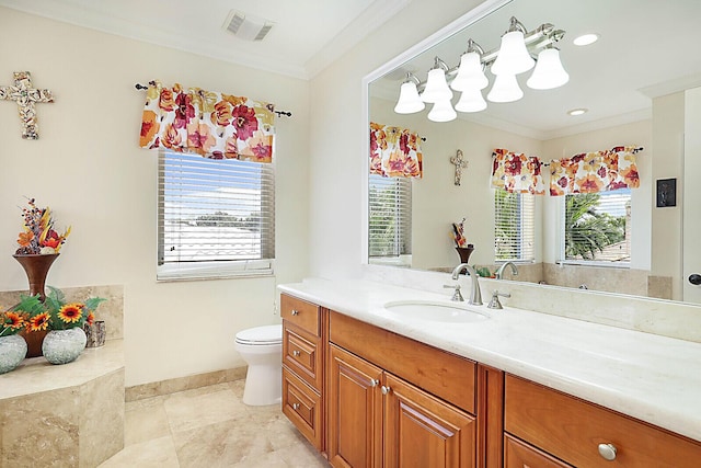 bathroom featuring vanity, toilet, and ornamental molding