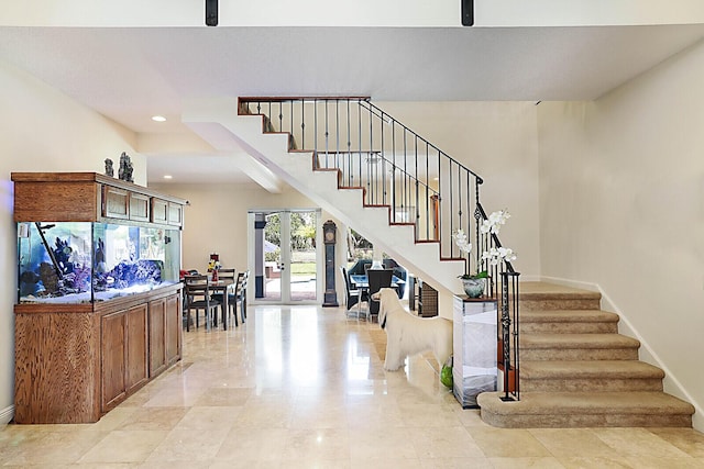 staircase featuring french doors