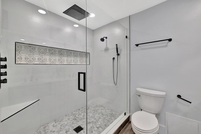 bathroom with toilet and walk in shower