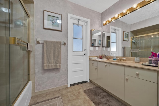 bathroom with combined bath / shower with glass door and vanity