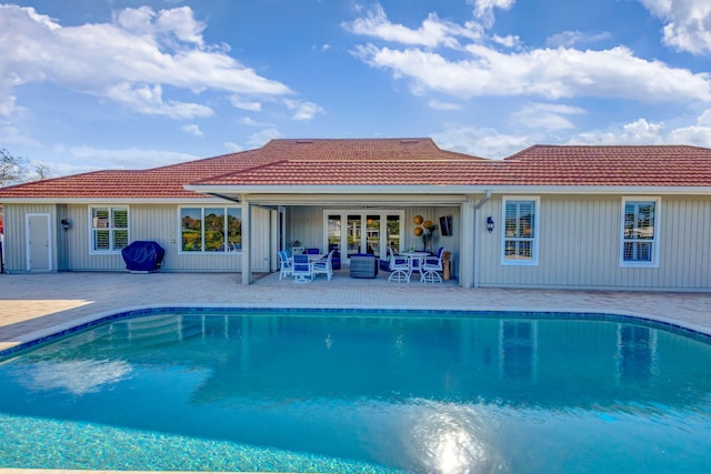 view of swimming pool with a patio