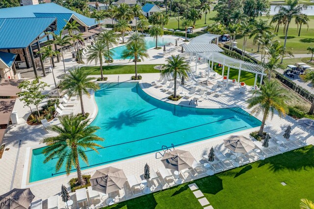 view of swimming pool with a patio area and a pergola