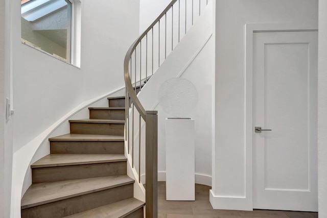 stairs with wood-type flooring