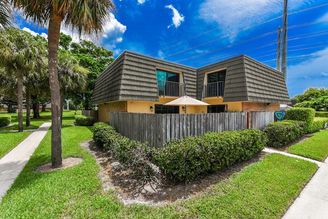 view of home's exterior with a yard