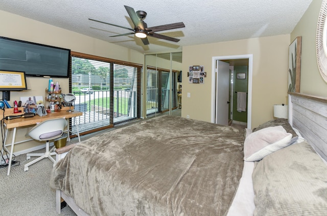 carpeted bedroom with ceiling fan, a textured ceiling, and access to outside