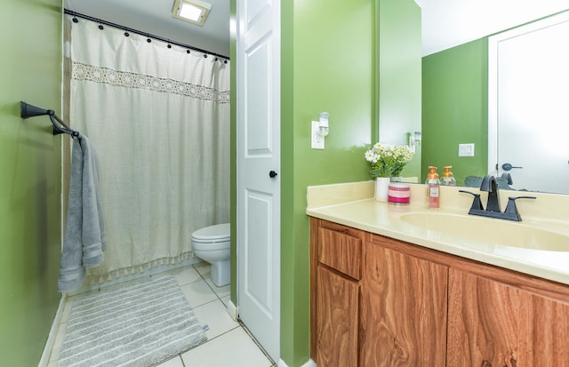 bathroom featuring tile patterned floors, curtained shower, vanity, and toilet