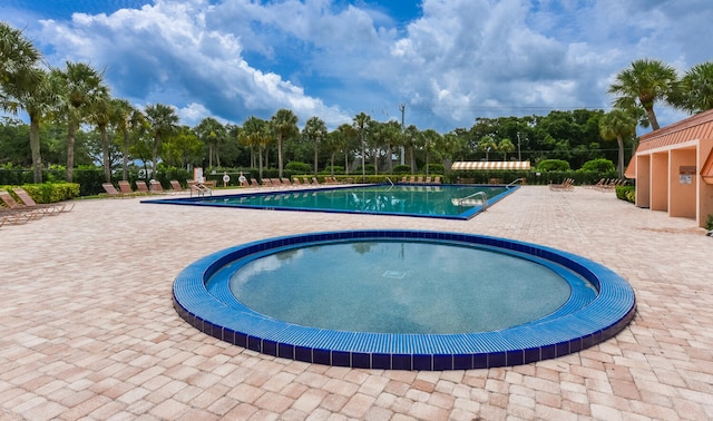 view of pool featuring a patio