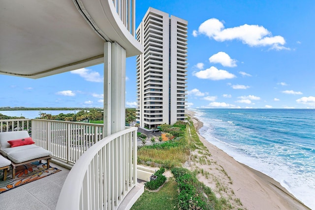 balcony with a beach view and a water view