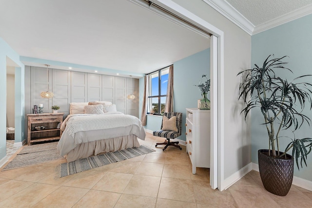 bedroom with a textured ceiling, light tile patterned flooring, and crown molding