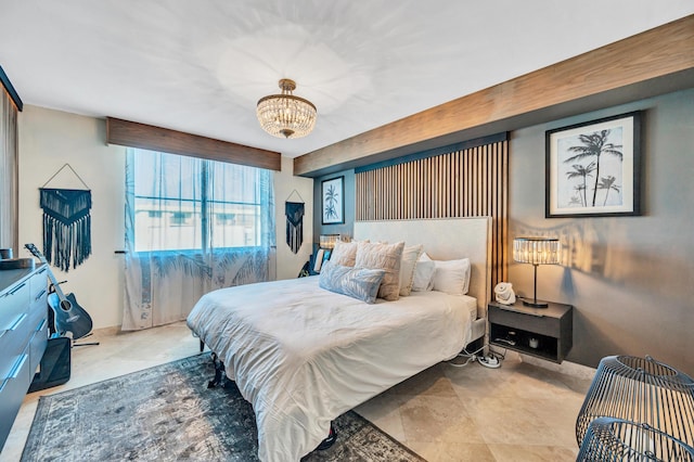 bedroom with an inviting chandelier