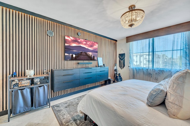 bedroom with tile patterned flooring and a notable chandelier