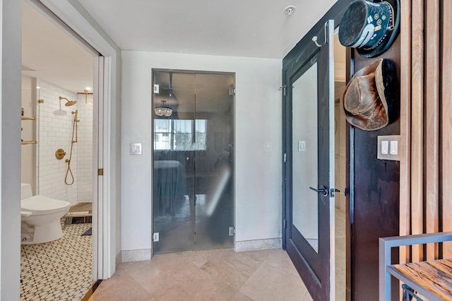 corridor featuring light tile patterned flooring