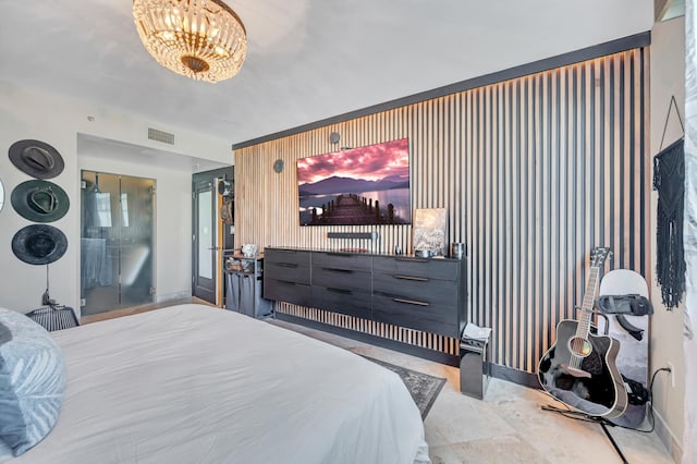 bedroom with a notable chandelier and wood walls