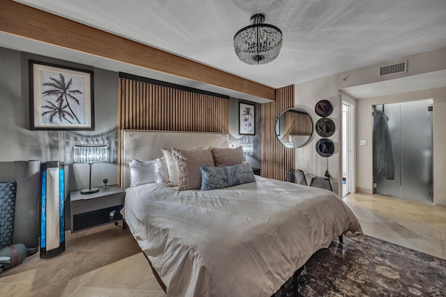 bedroom with an inviting chandelier