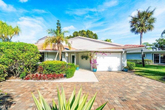 ranch-style house with a front lawn and a garage