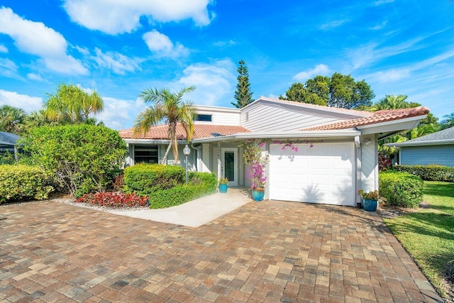 ranch-style home featuring a garage