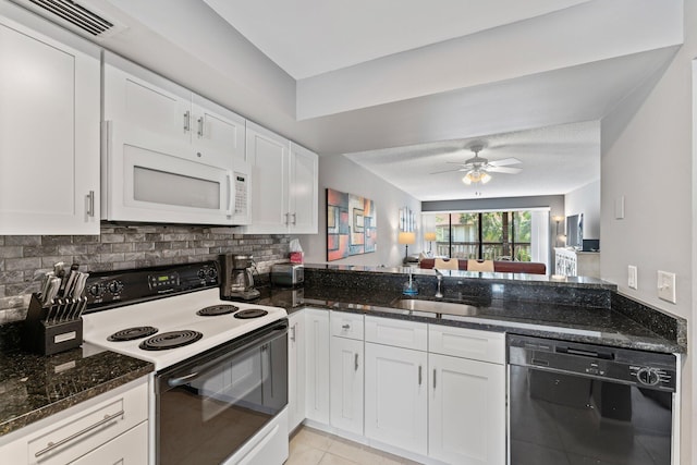 kitchen featuring white cabinets, white appliances, and sink