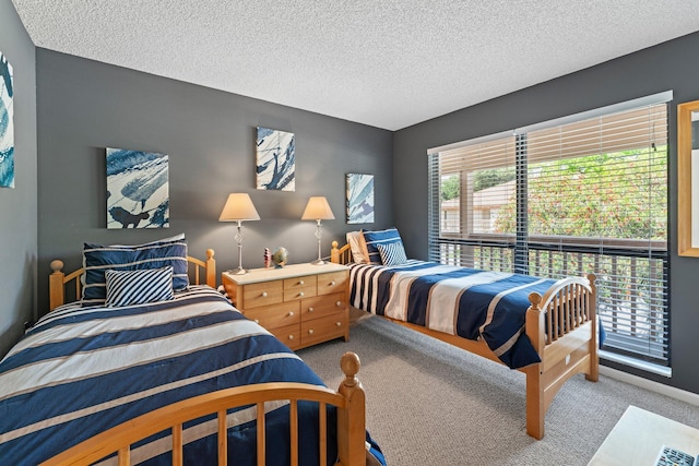 carpeted bedroom with a textured ceiling