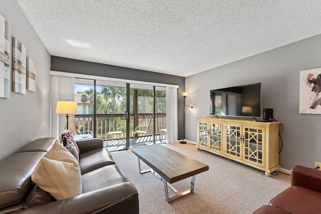 carpeted living room featuring a textured ceiling