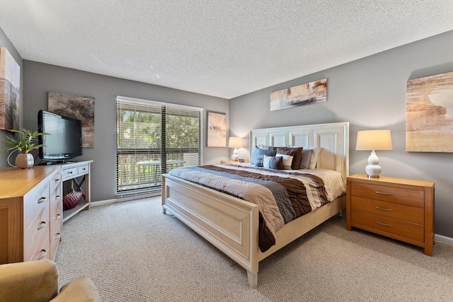 carpeted bedroom featuring a textured ceiling