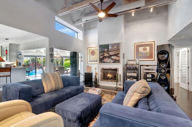 living room featuring high vaulted ceiling, wood-type flooring, beamed ceiling, and ceiling fan