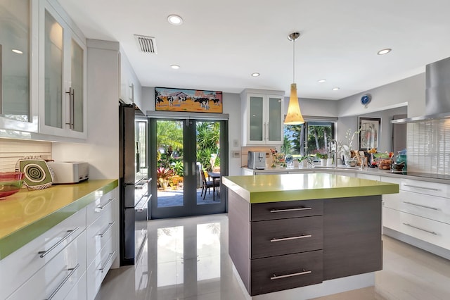 kitchen with white cabinetry and dark brown cabinetry