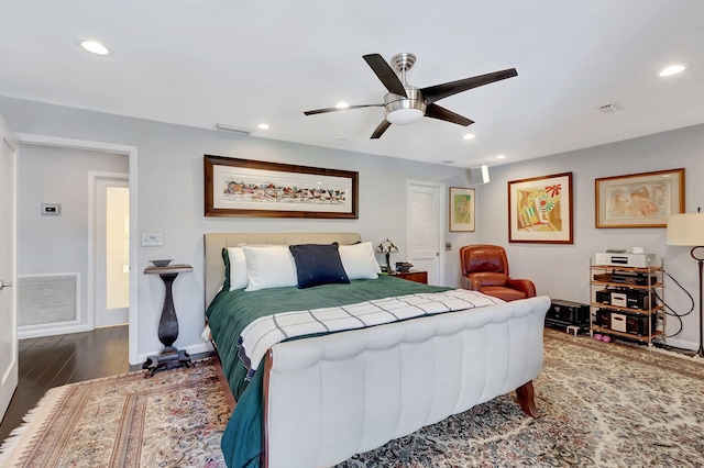 bedroom featuring dark wood-type flooring and ceiling fan