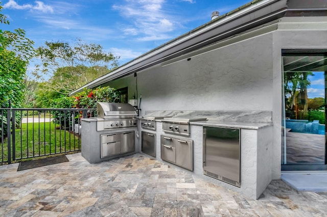 view of patio / terrace with a grill and exterior kitchen