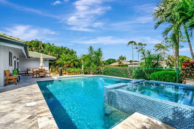 view of swimming pool with an in ground hot tub, a patio area, and an outdoor hangout area